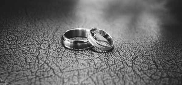 close up of wedding rings on floor